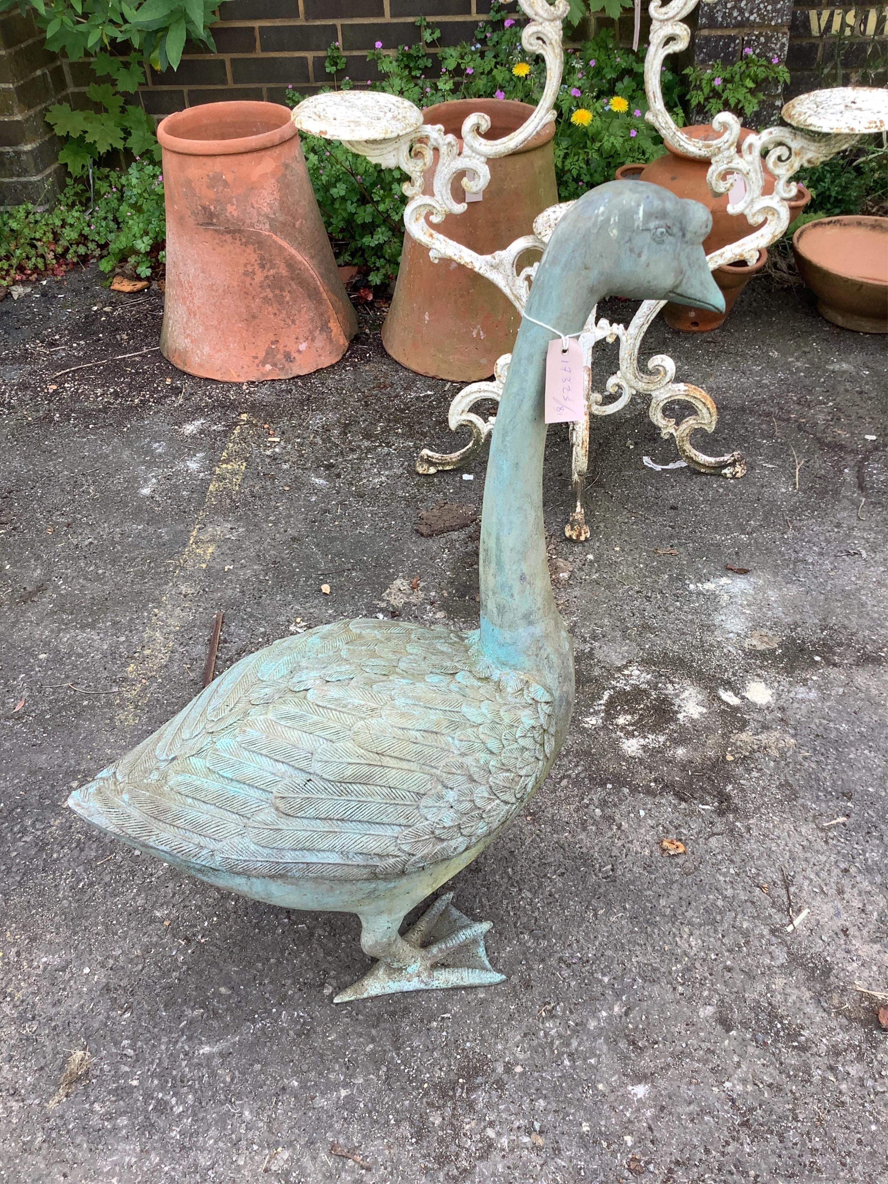 A cast patinated metal model of a goose, height 76cm